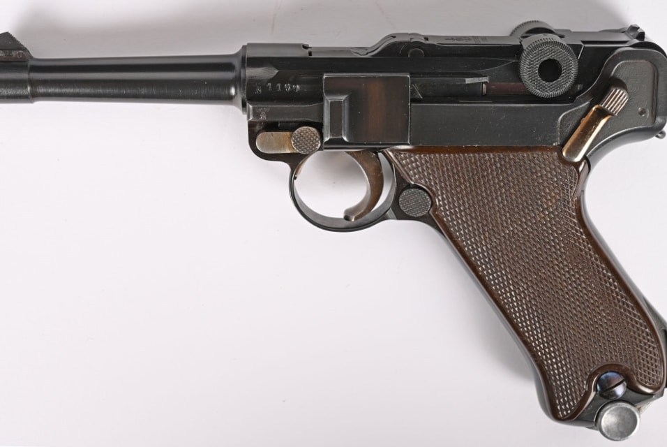 Krieghoff Commercial P Code 9mm pistol manufactured in 1940. Retains deep-blue finish with Eagle over “N” on upper and lower frame sections and “HK” with an anchor over “Krieghoff Suhl” on the toggle. Standard serrated-blade front sight with V-notch rear, straw-finish safety, trigger and take-down lever. Flawless example. Fine working order. Estimate: $10,000-$15,000.